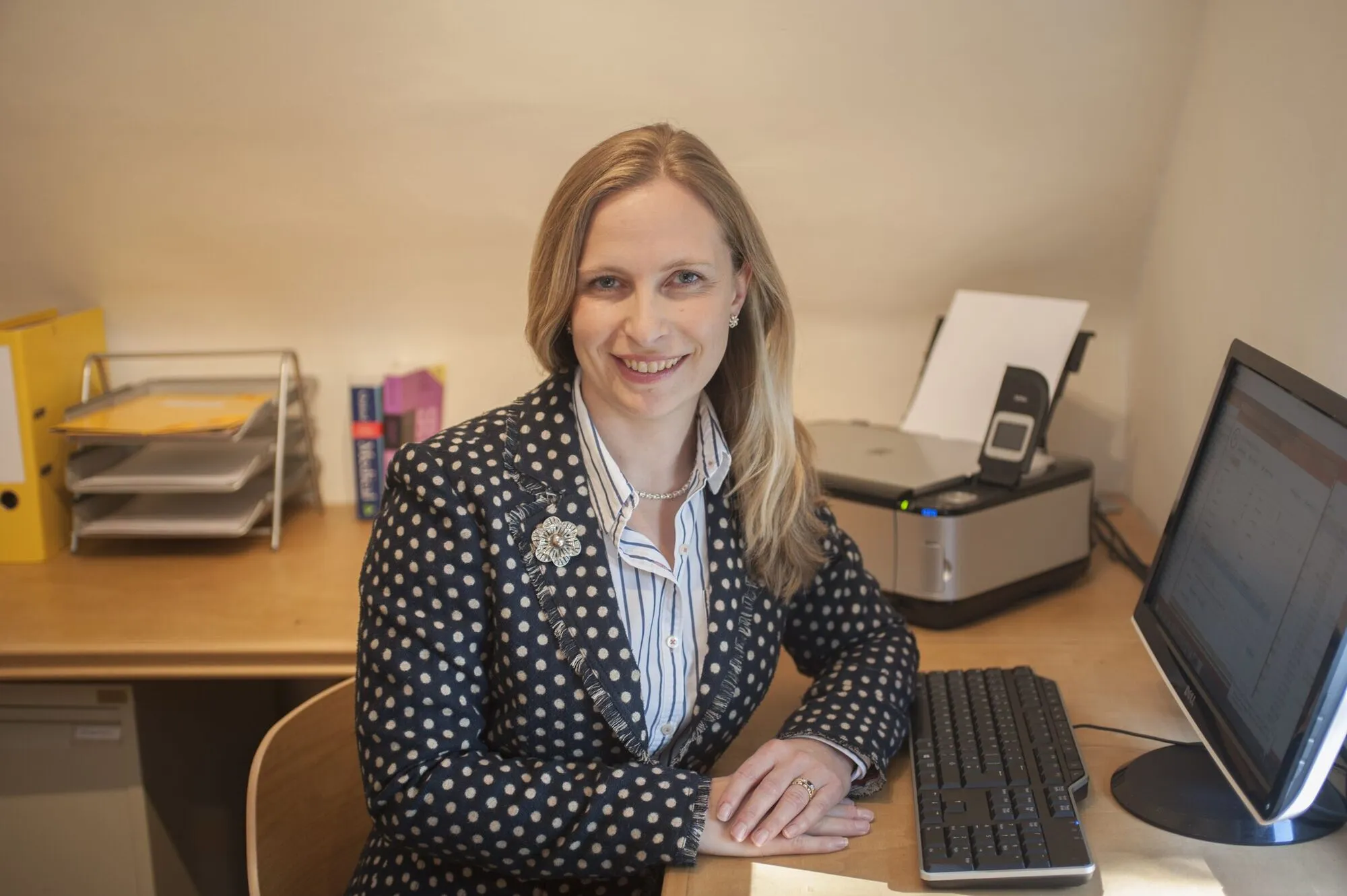 Environmental business portrait at a desk