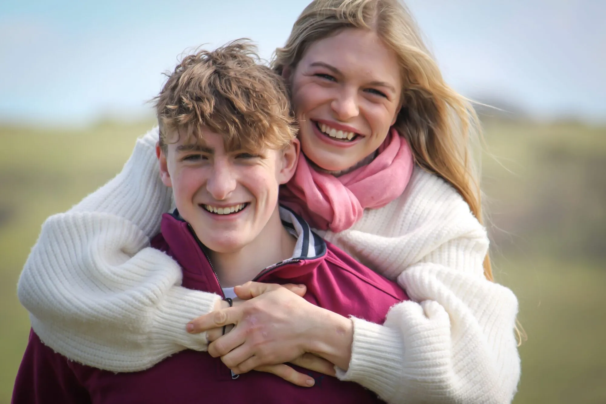 A relaxed brother and sister portrait outdoors